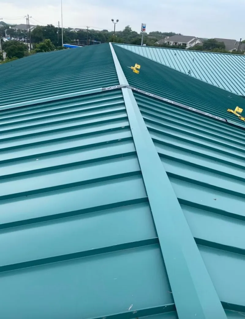 Green commercial metal roof ridge and valley for Metal Roof Repair in Tanaina